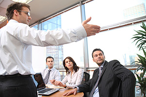 image of man giving  presentation in an office